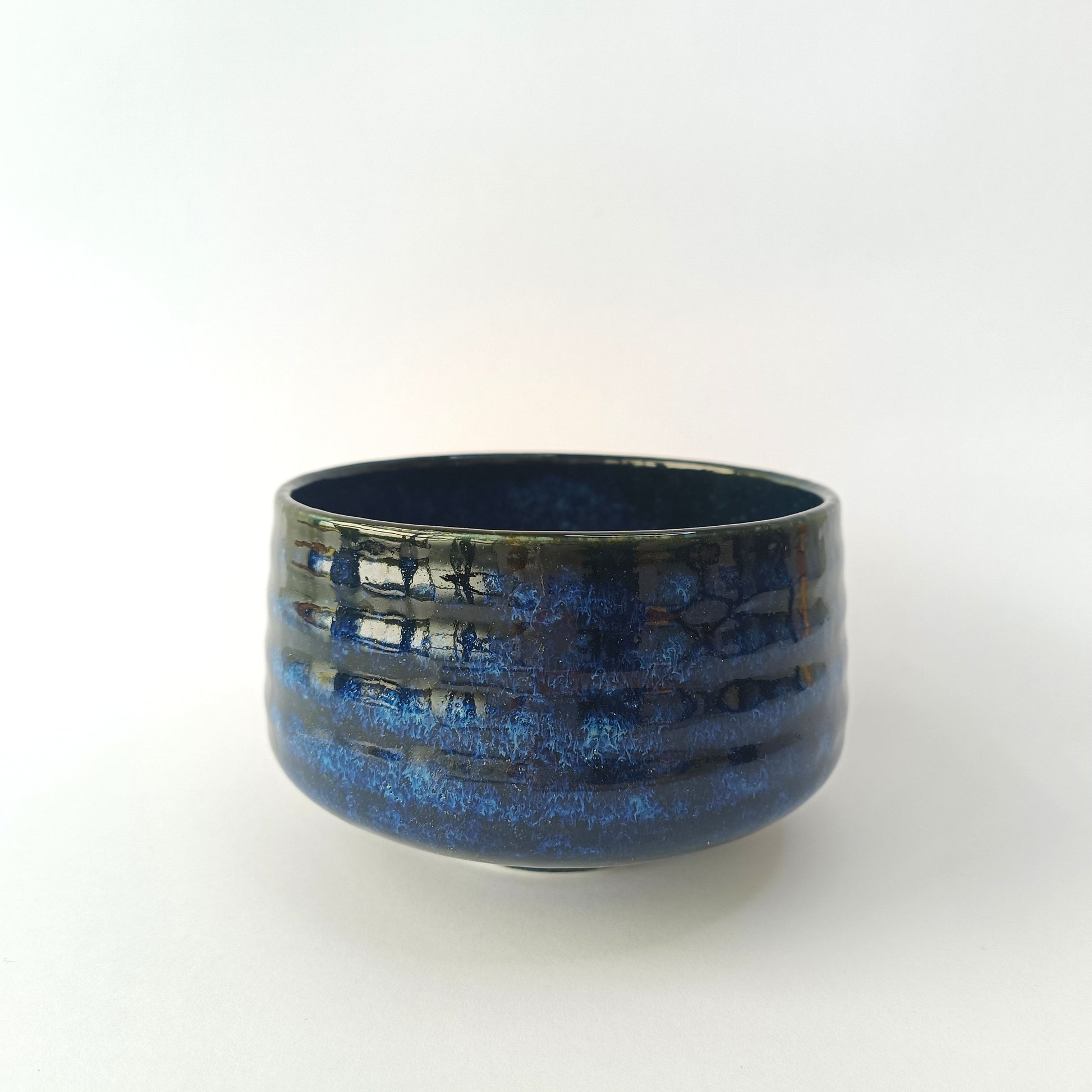 Blue ceramic bowl on a white background